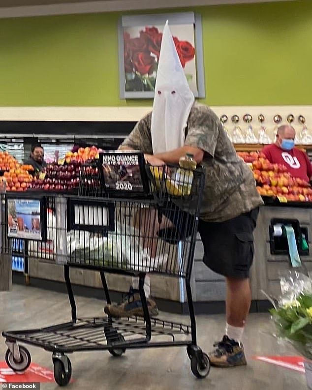 Shopper in Vons store wearing a KKK mask as a face mask